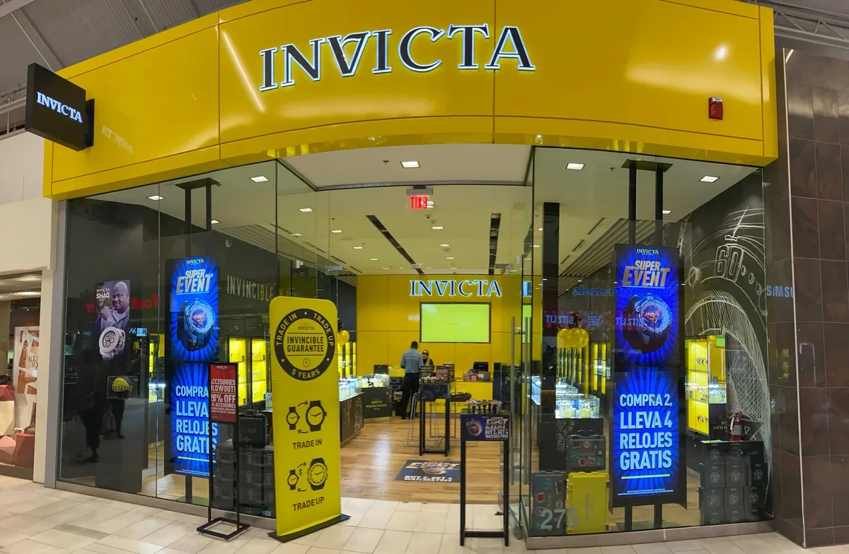 Invicta store with branded digital displays at the entrance