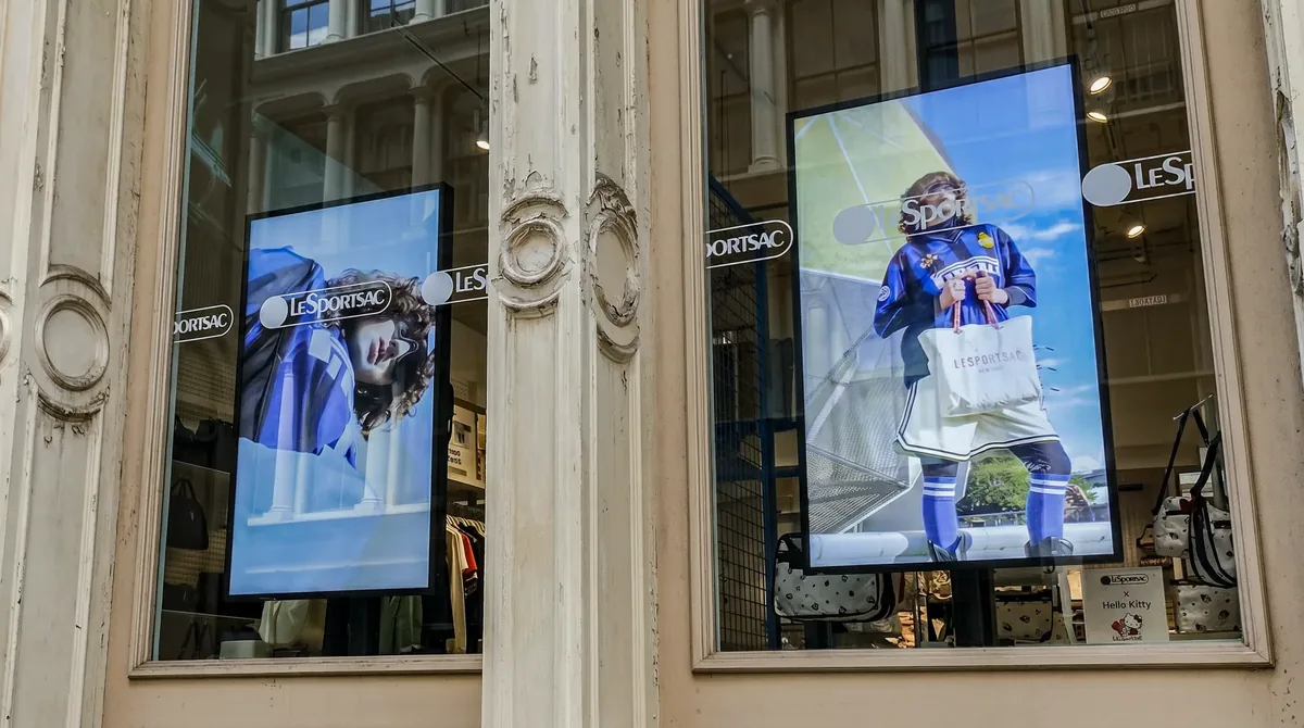 Storefront window digital signage: two high-brightness displays in the LeSportsac SoHo windows on Greene Street